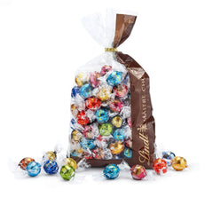Čokoládová směs LINDOR | 1371 g | Přibl. 109 kuliček: Mléčná čokoláda a kuličky LINDOR s jahodovým krémem | 1 kg pytel, cca. 80 čokoládových kuliček bílá čokoláda s jahodovým krémem