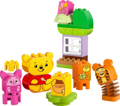 LEGO DUPLO - Narozeninová párty Disneyho Medvídka Pú - vzdělávací hračka pro předškoláky - sada 3 minifigurek včetně Medvídka Pú, Tygra a prasátka - tip na dárek pro chlapce a dívky od 1,5 roku 10457 Beuche stavebnice v LEGO-Store