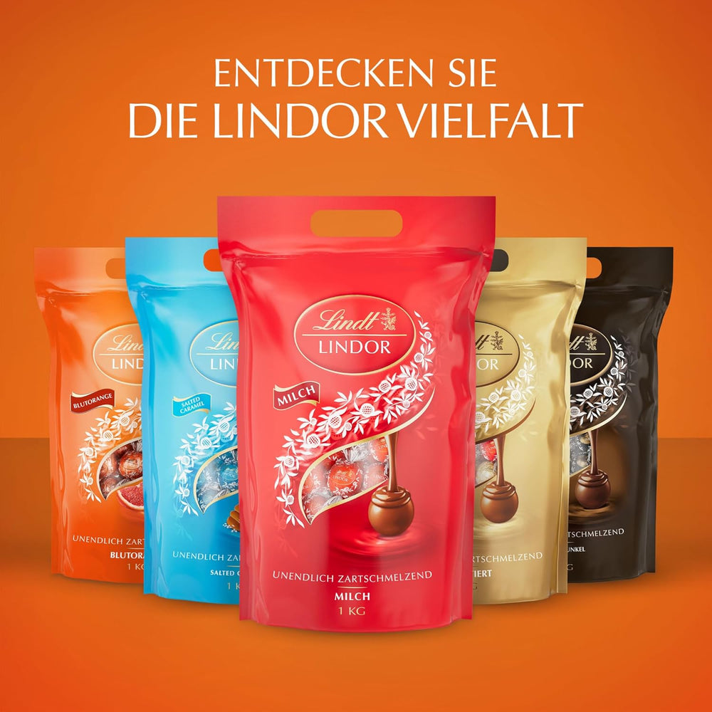 Lindt LINDOR Čokoládové kuličky červené oranžové | 1 kg uzavíratelný sáček | cca. 80 čokoládových bonbonů s náplní rozplývající se v ústech | Hromadné balení, čokoládový dárek