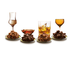 Jemné kapky v brandies klasické ořechy 250 g tekuté čokoládové pralinky s polevou z mléčné čokolády a křupavými kousky lískových oříšků